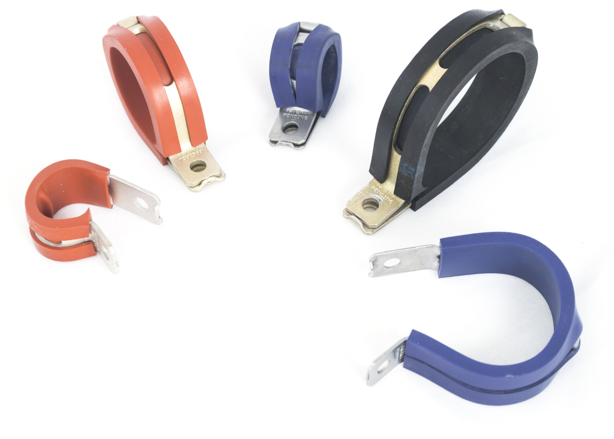 various magnetic cores in orange, blue, and black colors with universal clamps and metal attachments, isolated on a white background.