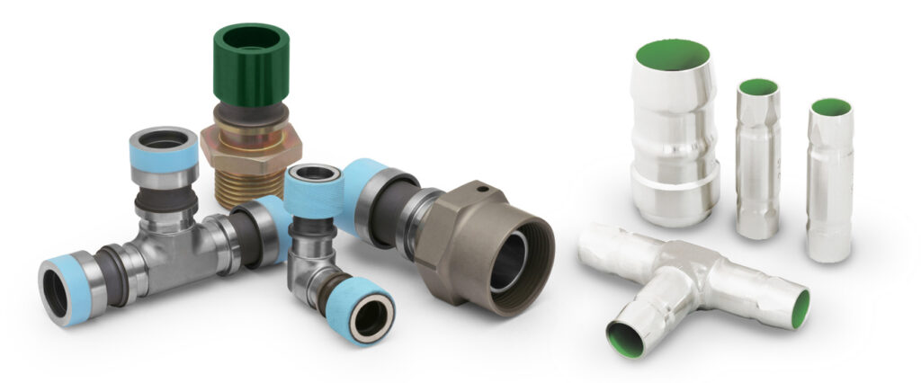 an assortment of metal pipe fittings with different connectors, some with colored ends, suitable for tooling and repair, isolated on a white background.