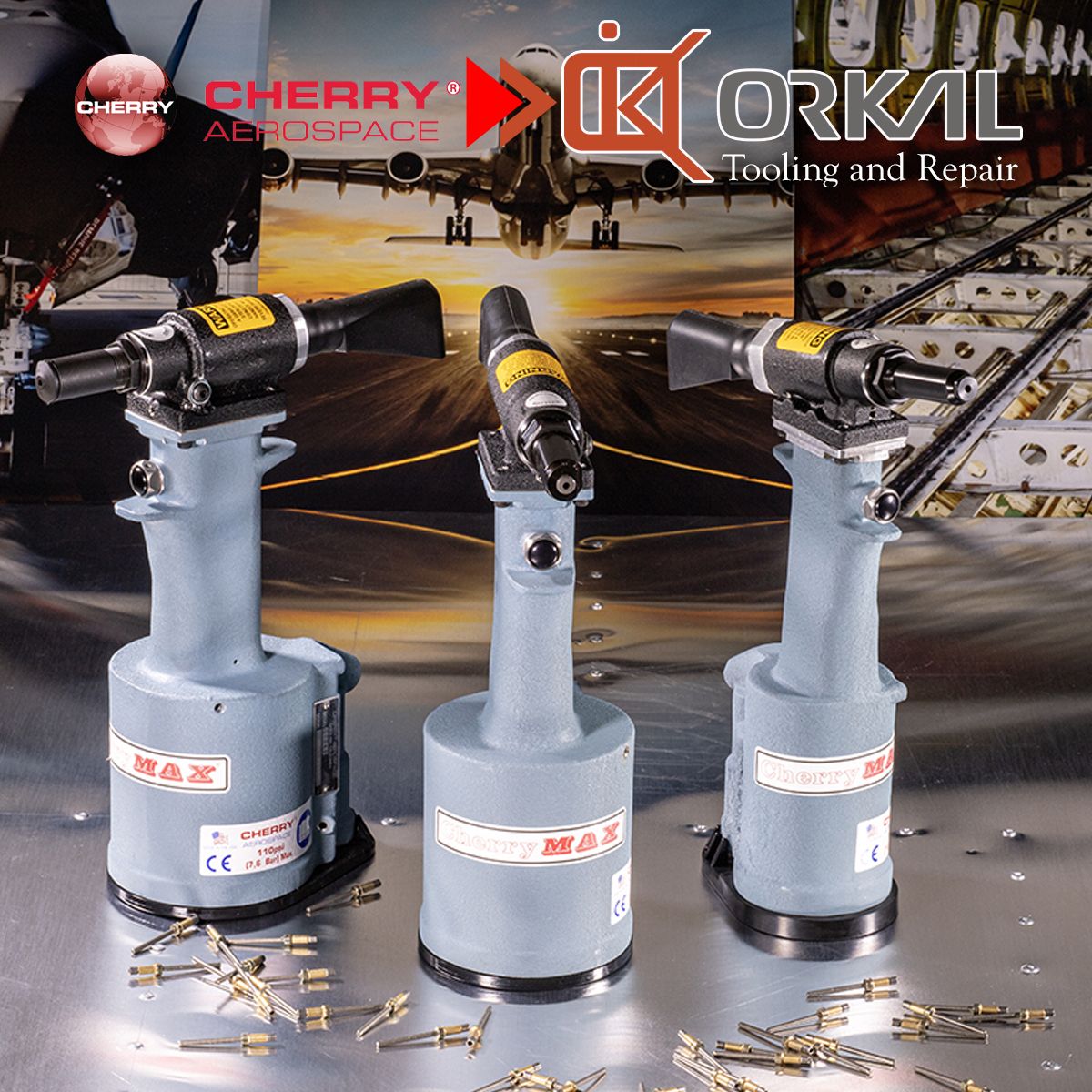 orkal, three industrial-grade cherry max pneumatic rivet guns, aircraft fittings, tooling scattered; brand logos in aviation assembly and repair contexts.